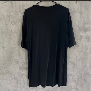 Medium Helmut Lang Tee with mesh detailing at the bottom. Lightly worn.